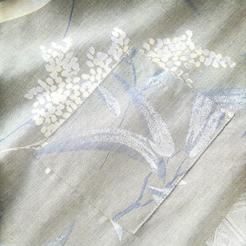 Le Monde du Peignoir grey cotton jacquard kimono with blue and white floral print and a chest pocket.
