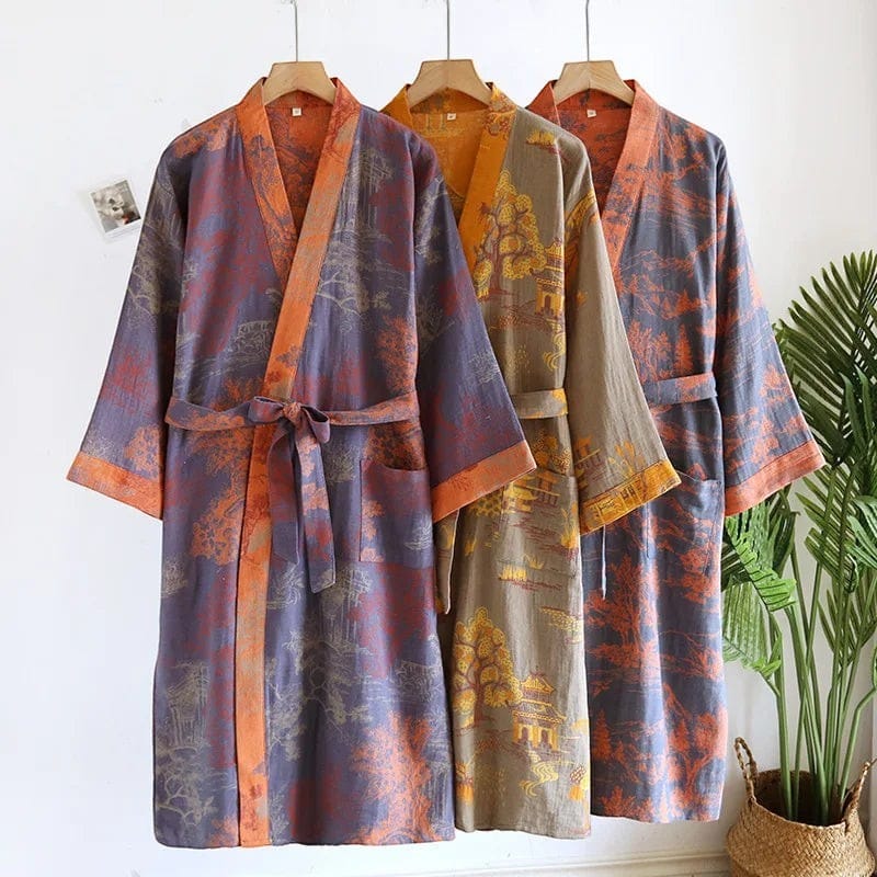 Le Monde du Peignoir men's Japanese-style kimono robe in woven jacquard cotton. Features a landscape print in purple, orange, and tan with wide sleeves and a tie belt.