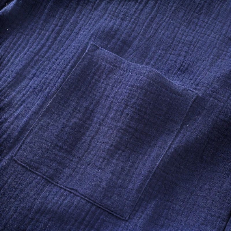 Le Monde du Peignoir navy blue lightweight cotton kimono with chest pocket and textured fabric.